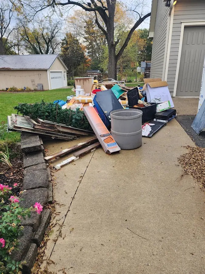 Dumpster being loaded with debris for Demolition Dumpster Rental in Eastmont